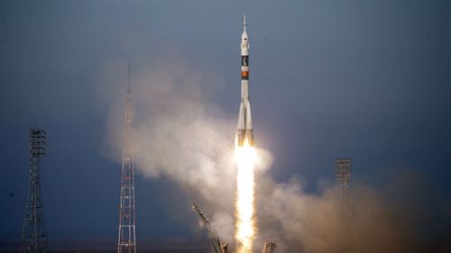 The Russian Soyuz TMA-19M lifts off from Baikonur Cosmodrome in Kazakhstan. (EPA/MAXIM SHIPENKOV)