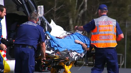 Joel Mason was surfing near Scotts Head Beach when he was bitten on the leg by a shark.