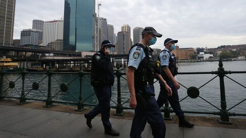 NSW Police are seen patrolling Circular Quay.