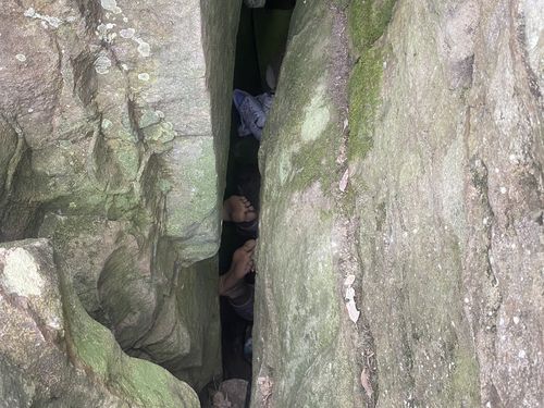 Woman stuck between two boulders in NSW