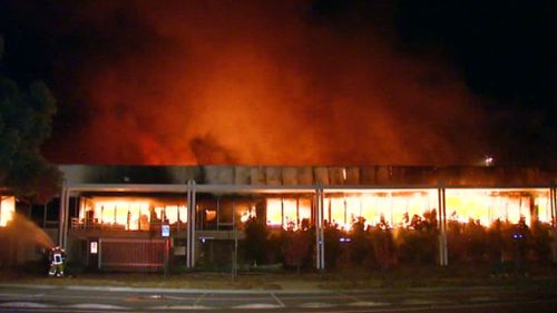 The Hoxton Park building up in flames (9NEWS)
