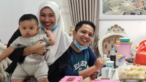 Rizki Wahyudi, 26, and his wife Indah Halimah Putri, 26, are seen with their 7-month-old son, Arkana Nadhif Wahyudi.