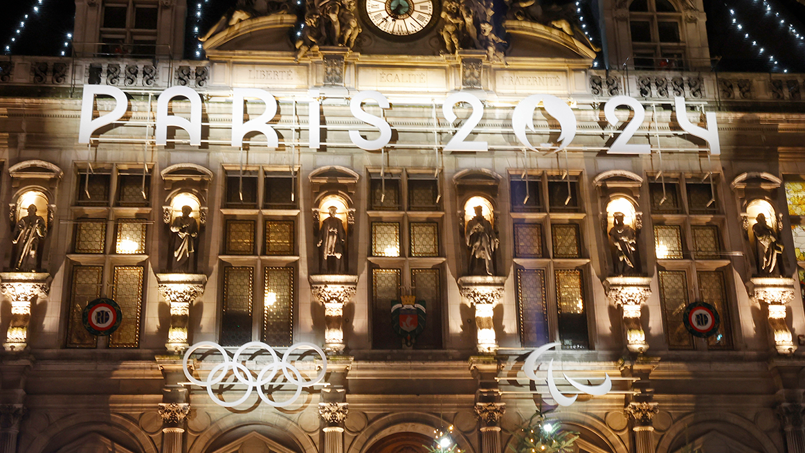 The Paris 2024 logo is illuminated on the facade of the Paris town hall ahead of the  Paris 2024 Olympic and Paralympic Games.