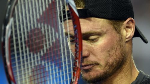 A shattered Lleyton Hewitt reacts after his second round loss to Benjamin Becker. (AAP)