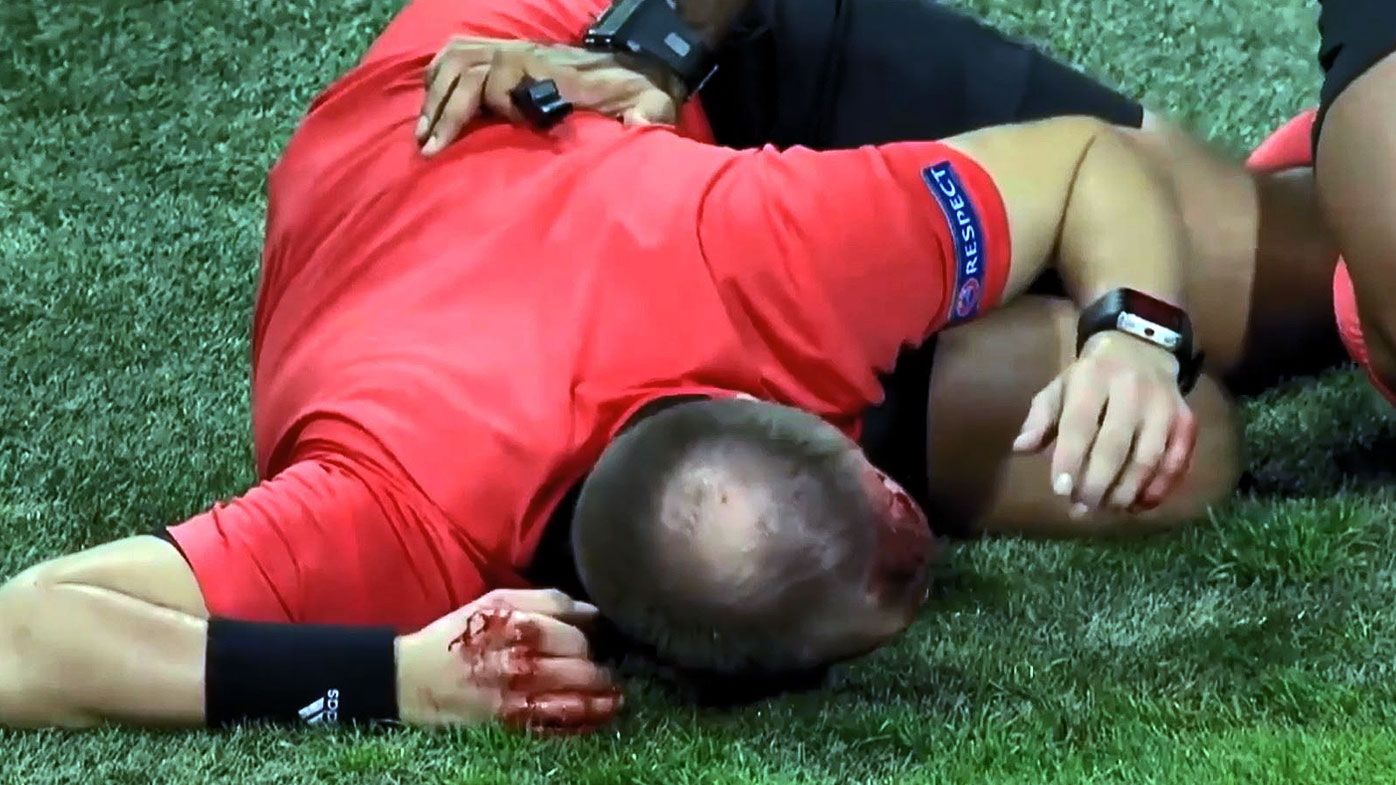 Football: Linesman cops nasty cut to head after crowd launch projectile in Europa League