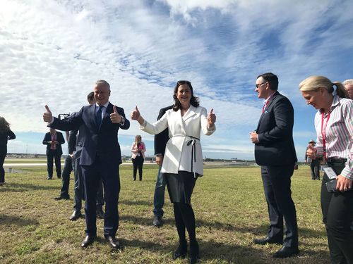 Premier Annastacia Palaszczuk celebrates at Brisbane Airport.