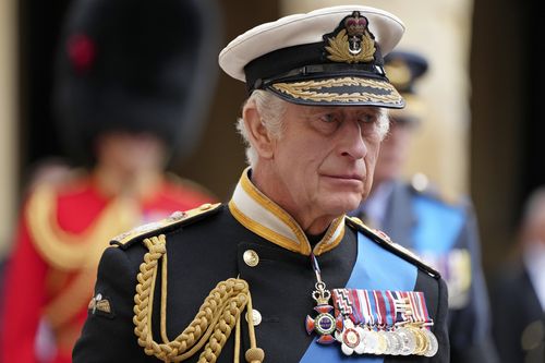 King Charles III follows the hearse with the coffin of Queen Elizabeth II moving towards St. George's Chapel at the Windsor Castle, in Windsor, England, Monday Sept. 19, 2022.