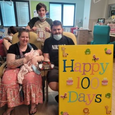 Ashlee and her family celebrating 100 days in NICU