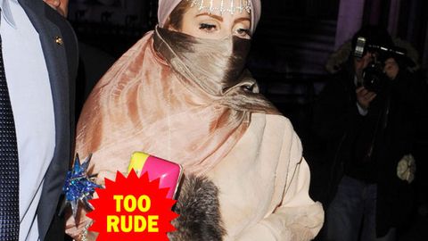 Attention seeker? Lady Gaga teams a burqa with a clutch that says the C-word