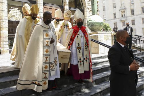 Pallbearers carry the casket holding the body of Archbishop Desmond Tutu after the funeral service in St. George's Cathedral in Cape Town, South Africa, Saturday, Jan. 1, 2022. 
