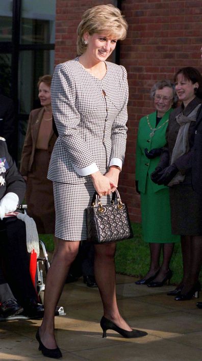 BIRMINGHAM, UNITED KINGDOM - OCTOBER 31 1995:  Princess Diana, Patron, Opening The National Institute Of Conductive Education At Cannon Hill House, Russell Road, Moseley, Birmingham.  The Princess Is Wearing A Black And White Houndstooth Check Suit And She Is Carrying A Christian Dior Black Handbag.  (Photo by Tim Graham Photo Library via Getty Images)