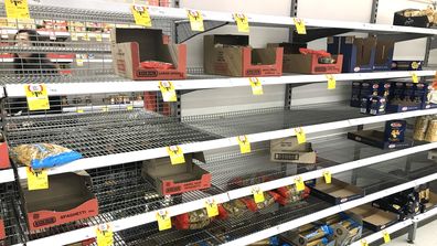 Supermarket shelves emptied of pasta and spaghetti.