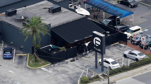 Law enforcement officials work at the Pulse nightclub following the shooting. (AP)