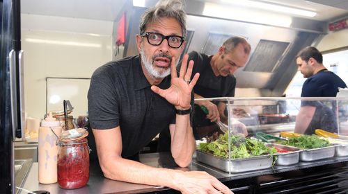 Actor Jeff Goldblum hands out sausages at food truck in Sydney