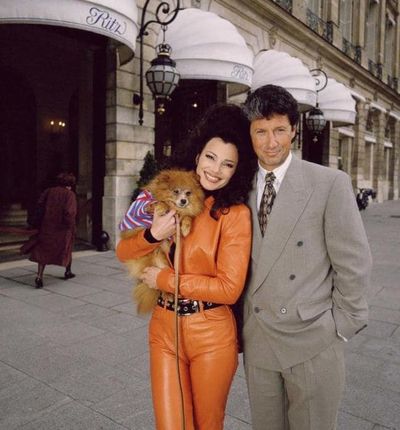 The Nanny's Fran Fine in an orange leather suit and Chanel belt with TV husband Maxwell Sheffield