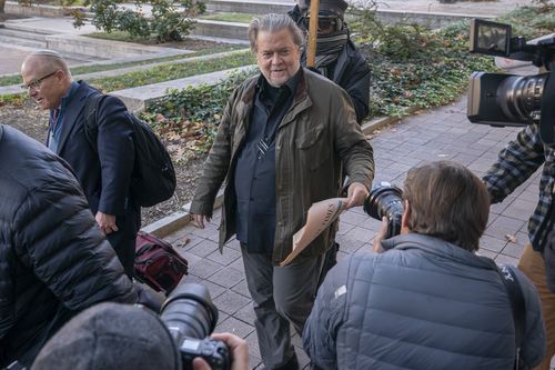 Steve Bannon, centre, a longtime ally of former President Donald Trump, convicted of contempt of Congress, arrives at federal court for a sentencing hearing, Friday, Oct. 21, 2022, in Washington.  