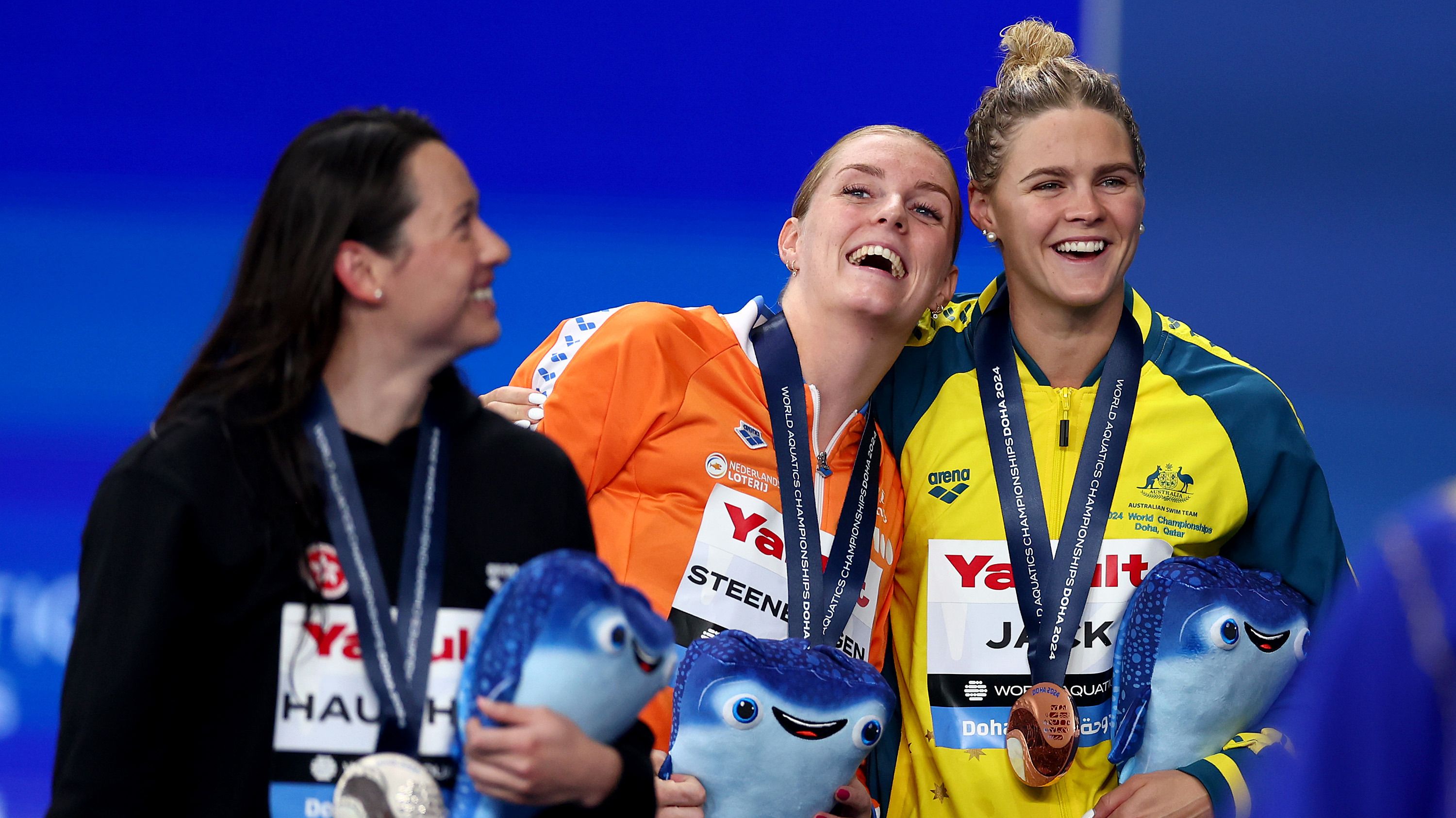 (L-R) Silver Medalist, Siobhan Bernadette Haughey of Team Hong Kong (obscured), Gold Medalist, Marrit Steenbergen of Team Netherlands and Bronze Medalist, Shayna Jack of Team Australia react as they leave the Medal Ceremony with their medals for the Women&#x27;s 100m Freestyle Final on day fifteen of the Doha 2024 World Aquatics Championships at Aspire Dome on February 16, 2024 in Doha, Qatar. (Photo by Maddie Meyer/Getty Images)
