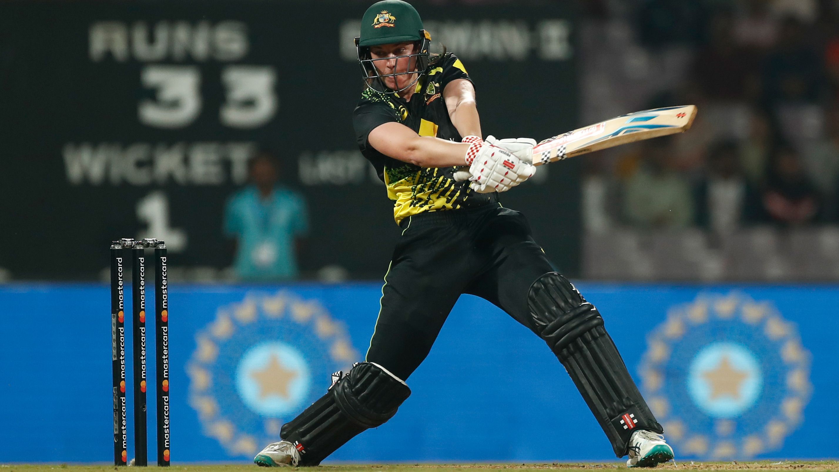 Tahlia McGrath of Australia plays a shot during the T20 International series between India and Australia at Dr DY Patil Cricket Stadium on December 11, 2022 in Mumbai, India. (Photo by Pankaj Nangia/Getty Images)