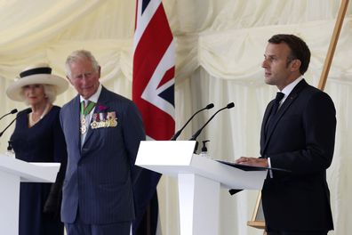 Prince Charles and Camilla, Duchess of Cornwall look on as French President Emmanuel Macron, right, makes a speech following laying a wreath at a ceremony at Carlton Gardens in London, Thursday June 18, 2020.  