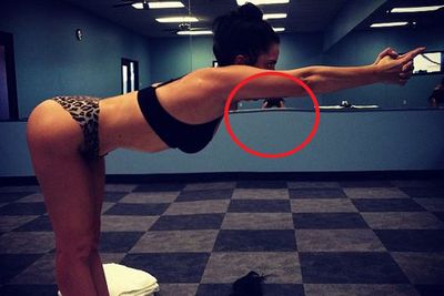 While Lady Gaga's bikram yoga shot should be enough to get us to the gym, the strangely distorted mirror behind her bend and stretch suggest she's retouched the snap. <br/><br/>Wasn't Gaga the one who called out #TeamGlamour for Photoshopping her on the cover of their mag?<br/><br/>So awks.