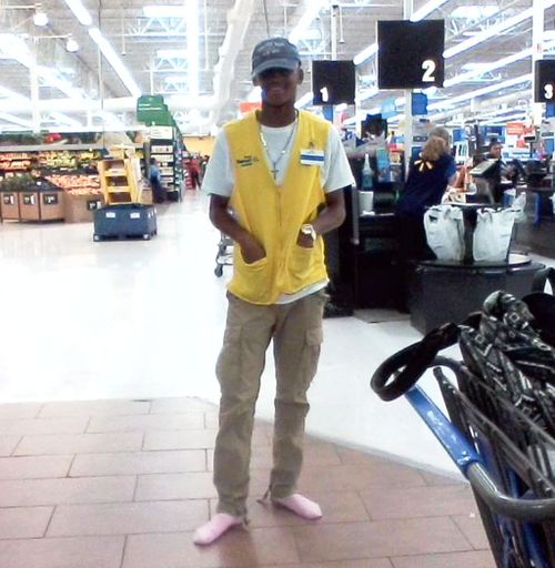 Walmart employee who once lived on the streets donates own shoes to homeless man