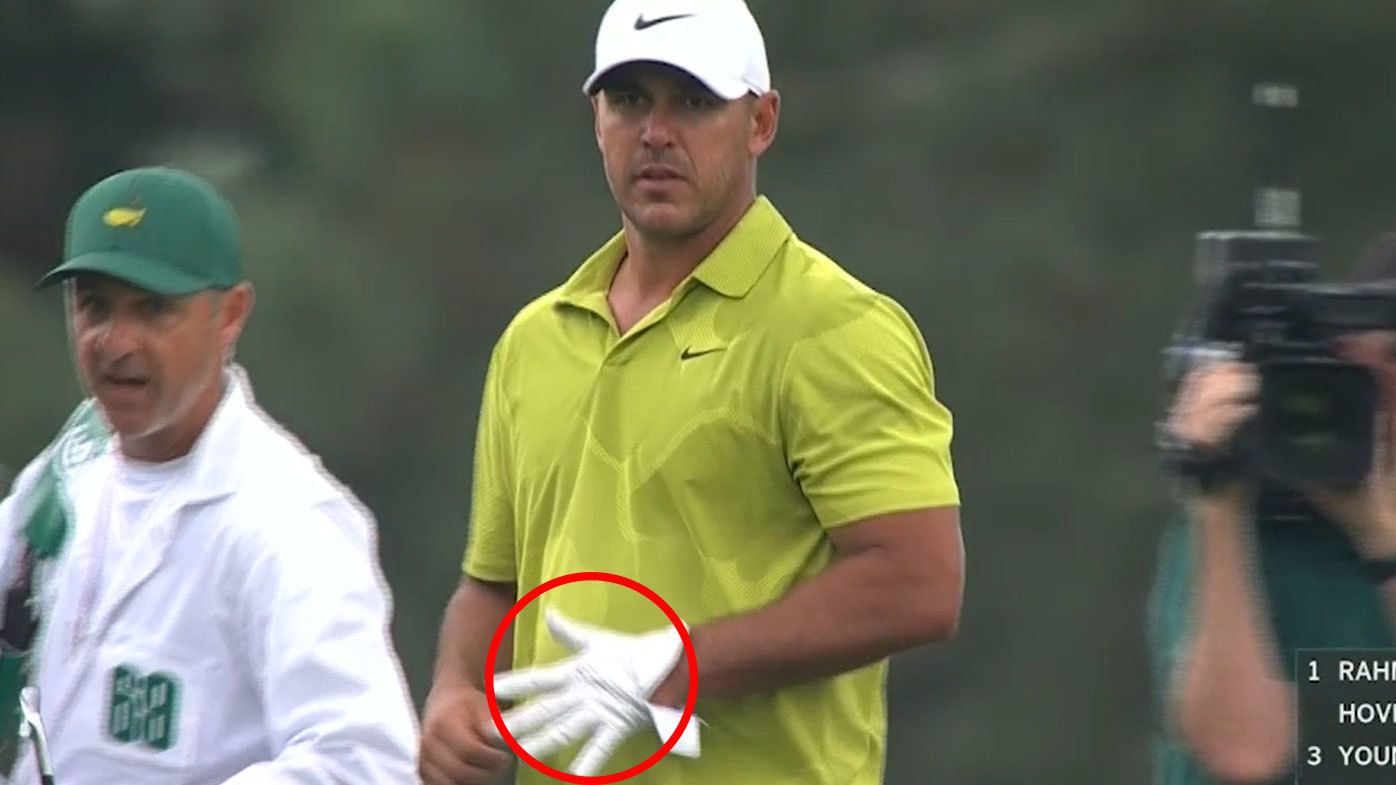 Brooks Koepka was questioned by the Masters committee after footage showed him appearing to signal the number five as he removed his glove