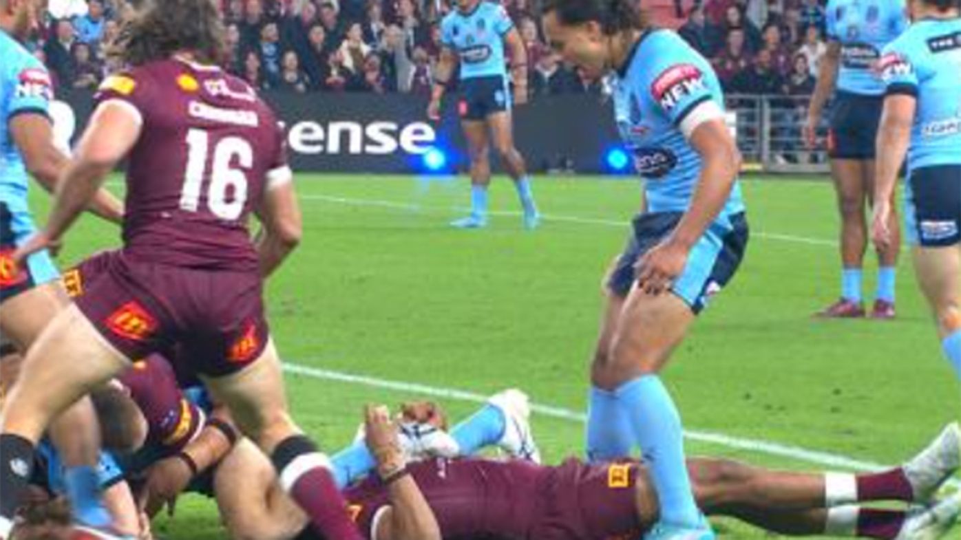 Jarome Luai stands over an unconscious Selwyn Cobbo.