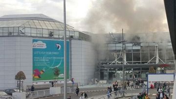 Smoke rises from Brussels' Zevantem Airport on March 22. (Twitter)