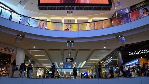 People shopping in Westfield Bondi Junction shopping centre .