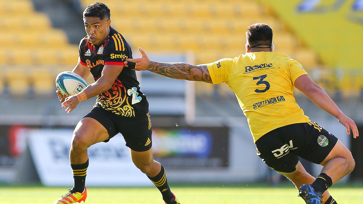 Josh Ioane of the Chiefs makes a break during the round seven Super Rugby Pacific match between the Hurricanes and the Chiefs at