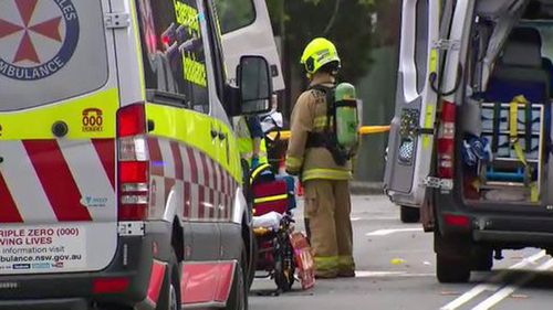 Firefighters work to clear the wreckage.