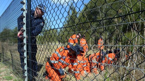SES volunteers conduct a search for clues as part of an investigation into the disappearance of Patricia Riggs in 2012. (AAP)