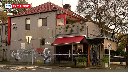 Police are searching for two men who allegedly threatened a barista with a weapon at a cafe in Sydney's inner west.