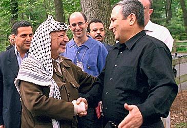 Who hosted Ehud Barak and Yasser Arafat at the 2000 Camp David Summit?