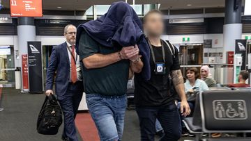 The man was flown to Sydney yesterday evening after his arrest on Sunday.