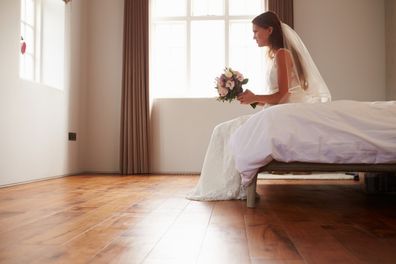 Bride In Bedroom Having Second Thoughts Before Wedding