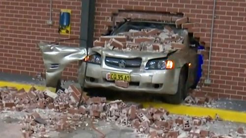 The woman drove through a wall of an ambulance station after losing control of her car in a hospital carpark.