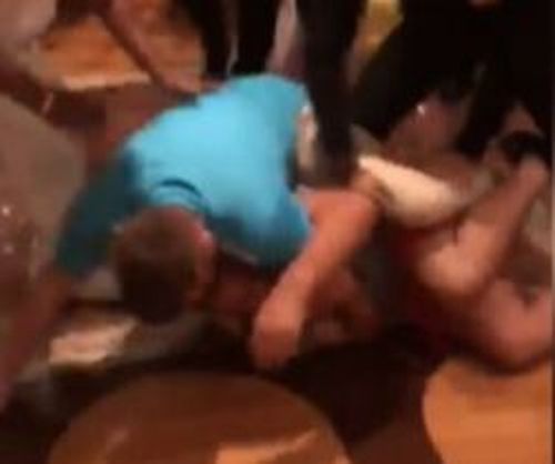 Passengers on-board a Carnival Cruise liner in the South Pacific have been filmed in a violent mass brawl (Supplied).