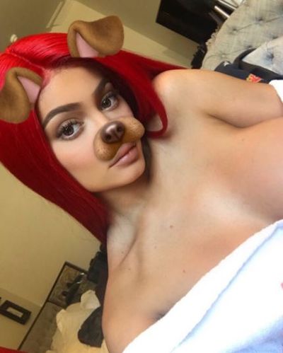 Kylie showed off her new bright red 'do in a series of playful selfies.