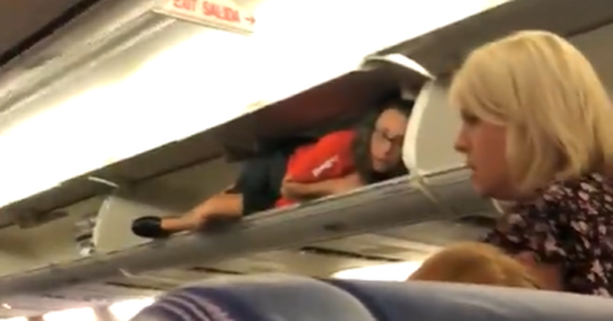 An airplane passenger was spotted in an overhead bin. Here's why that's a terrible idea