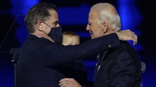 President-elect Joe Biden, right, embraces his son Hunter Biden, left, in Wilmington.