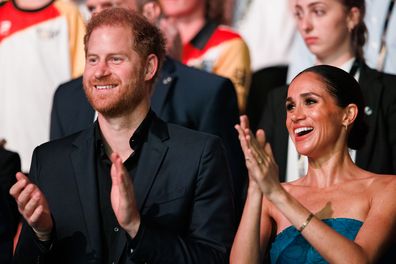 meghan and harry clapping during the closing ceremony of the invictus games