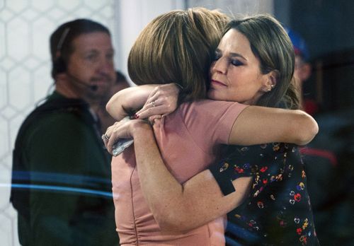Co-anchors Hoda Kotb, left, and Savannah Guthrie embrace on the set of the US Today show. (AAP)