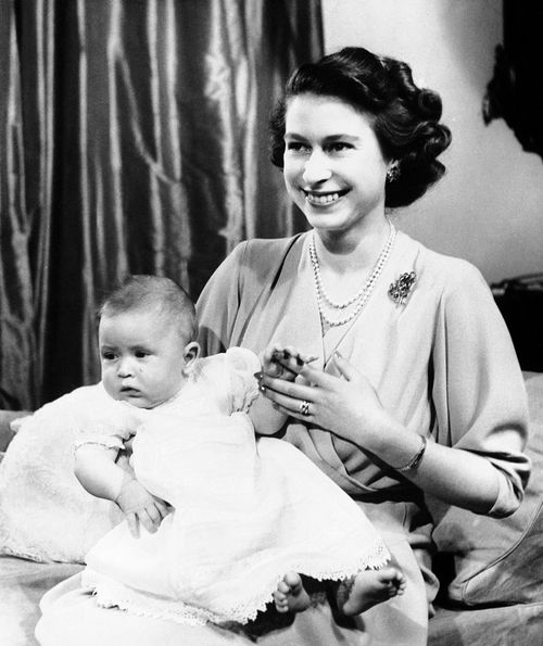 FILE - In this April 10, 1949 file photo, Prince Charles of Edinburgh, left, sits for a photo with his mother, Princess Elizabeth, in Buckingham Palace, London. Prince Charles has been preparing for the crown his entire life. Now, that moment has finally arrived. Charles, the oldest person to ever assume the British throne, became king on Thursday Sept. 8, 2022, following the death of his mother, Queen Elizabeth II. (AP Photo, File)
