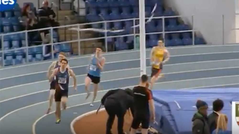 Athletics: Runner tripped up by pole vault bar on final lap