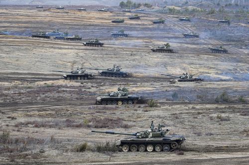 Tanks move during the Union Courage-2022 Russia-Belarus military drills at the Obuz-Lesnovsky training ground in Belarus, Saturday, Feb. 19, 2022. 