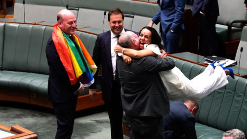 MPs celebrated after the vote passed. (AAP)