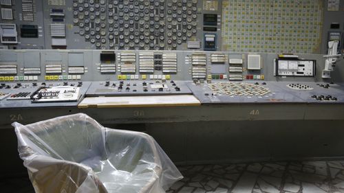 An operator's arm-chair covered with plastic sits in an empty control room of the 3rd reactor at the Chernobyl nuclear plant, in Chernobyl, Ukraine, on April 20, 2018