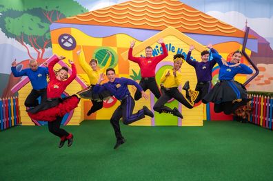 The eight current members of The Wiggles, including original Blue Wiggle Anthony Field (far left).