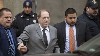 Harvey Weinstein, center, leaves court following a bail hearing, Friday, Dec. 6, 2019 in New York